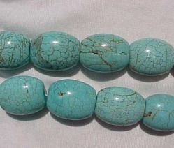 Magnesite Turquoise Flatter Barrels, 25x20mm, each