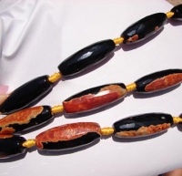 Orange & Black Onyx Faceted Barrels, 14x38mm, each